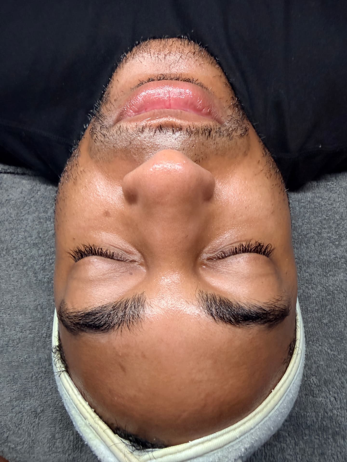 Male client relaxed after a deep-cleansing Gentlemen's Facial